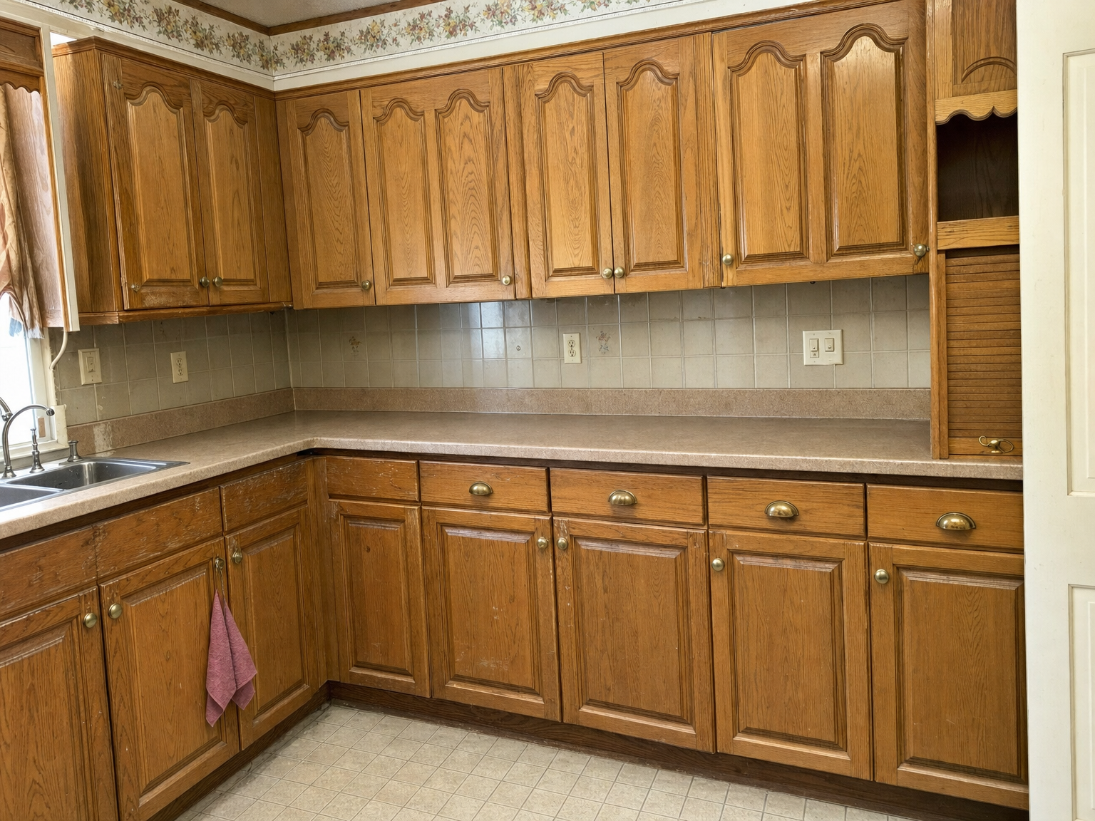 Kitchen cabinets before refacing — worn original doors