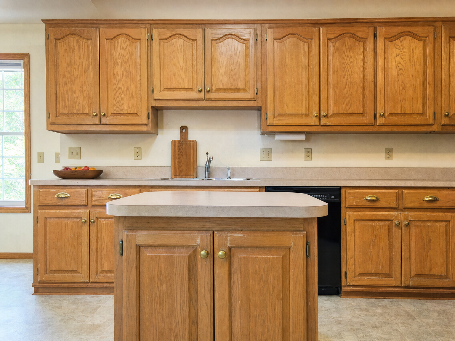 Kitchen cabinets before refacing — dated doors and finish