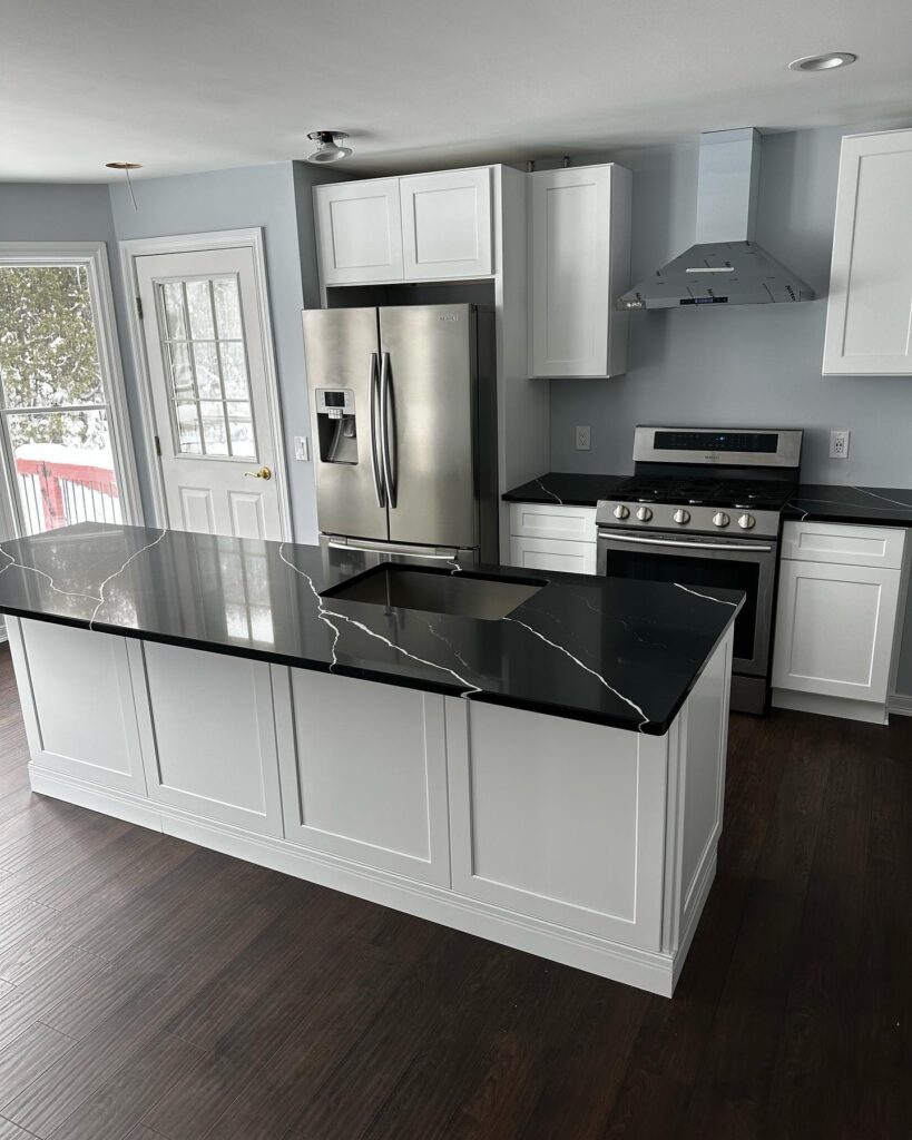 New quartz countertops installed in a Charlotte kitchen by Carolina Kitchens & Baths