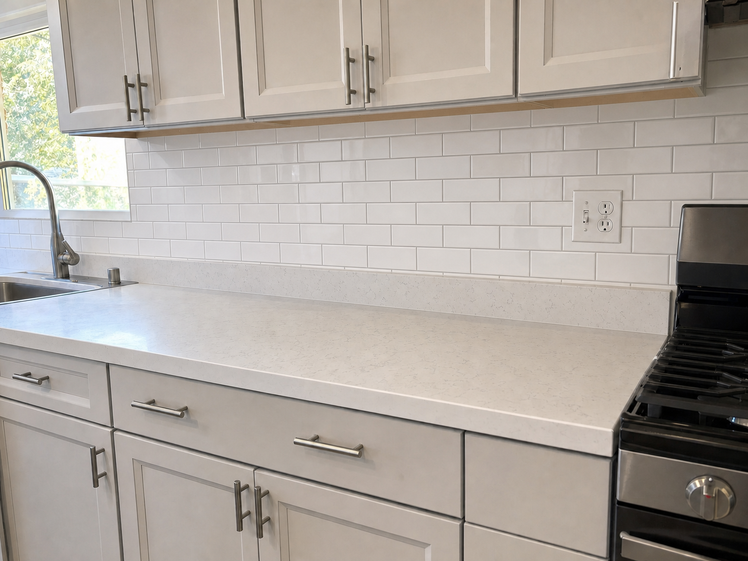 Kitchen after new glossy subway tile backsplash
